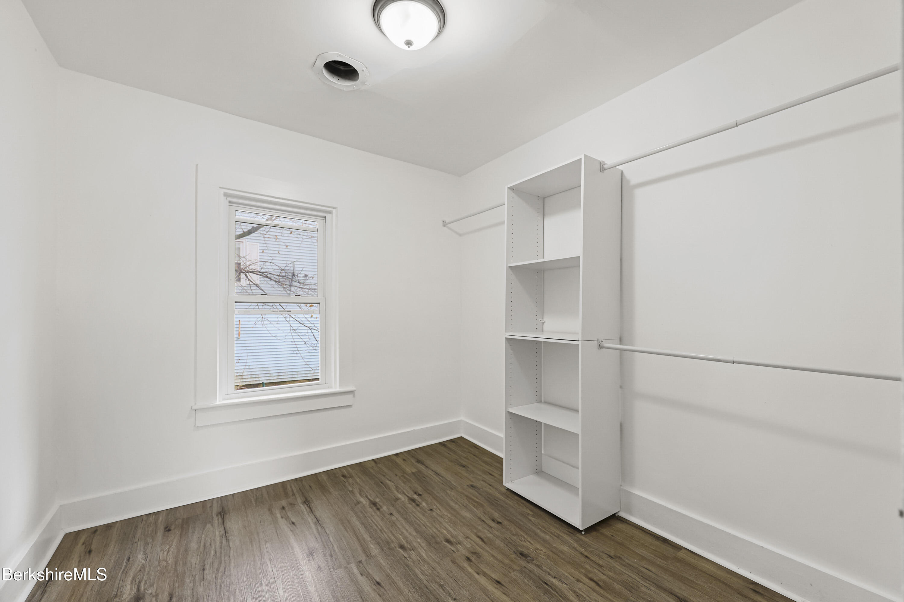 41 Prospect Street North Adams, MA 01247 - Photo 25 of 34 a view of an empty room with wooden floor and a window