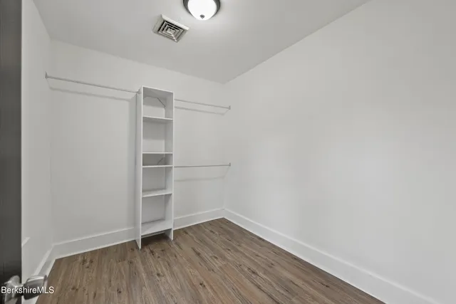 a view of an empty walk in closet