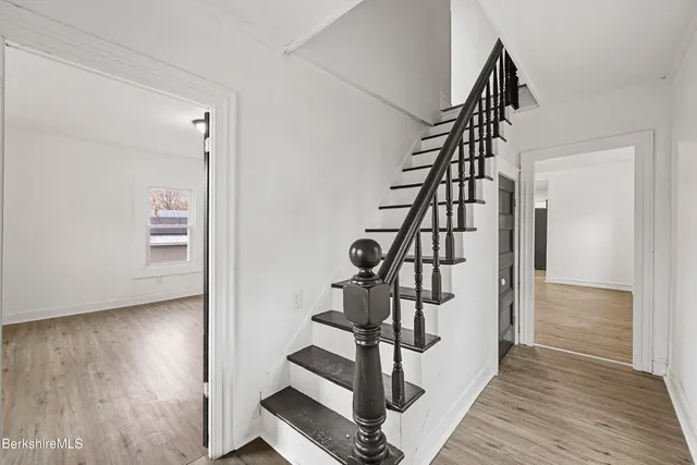 a view of entryway with wooden floor