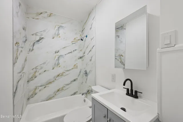 a bathroom with a sink and a bathtub