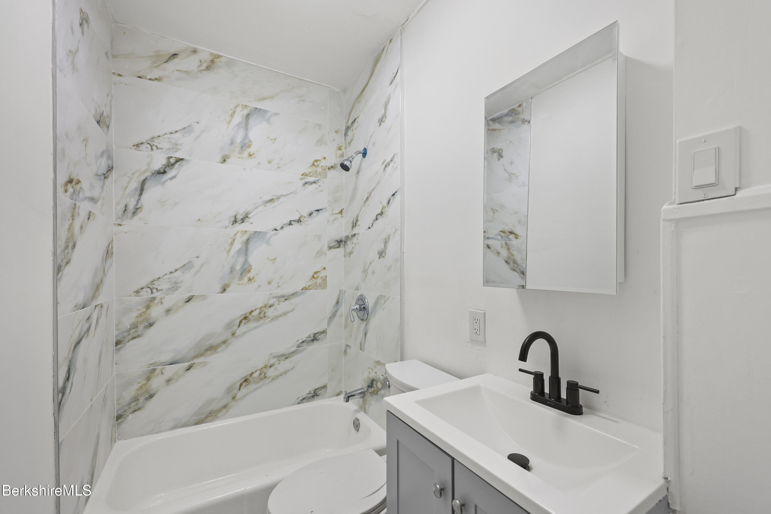 41 Prospect Street North Adams, MA 01247 - Photo 31 of 34 a bathroom with a sink and a bathtub