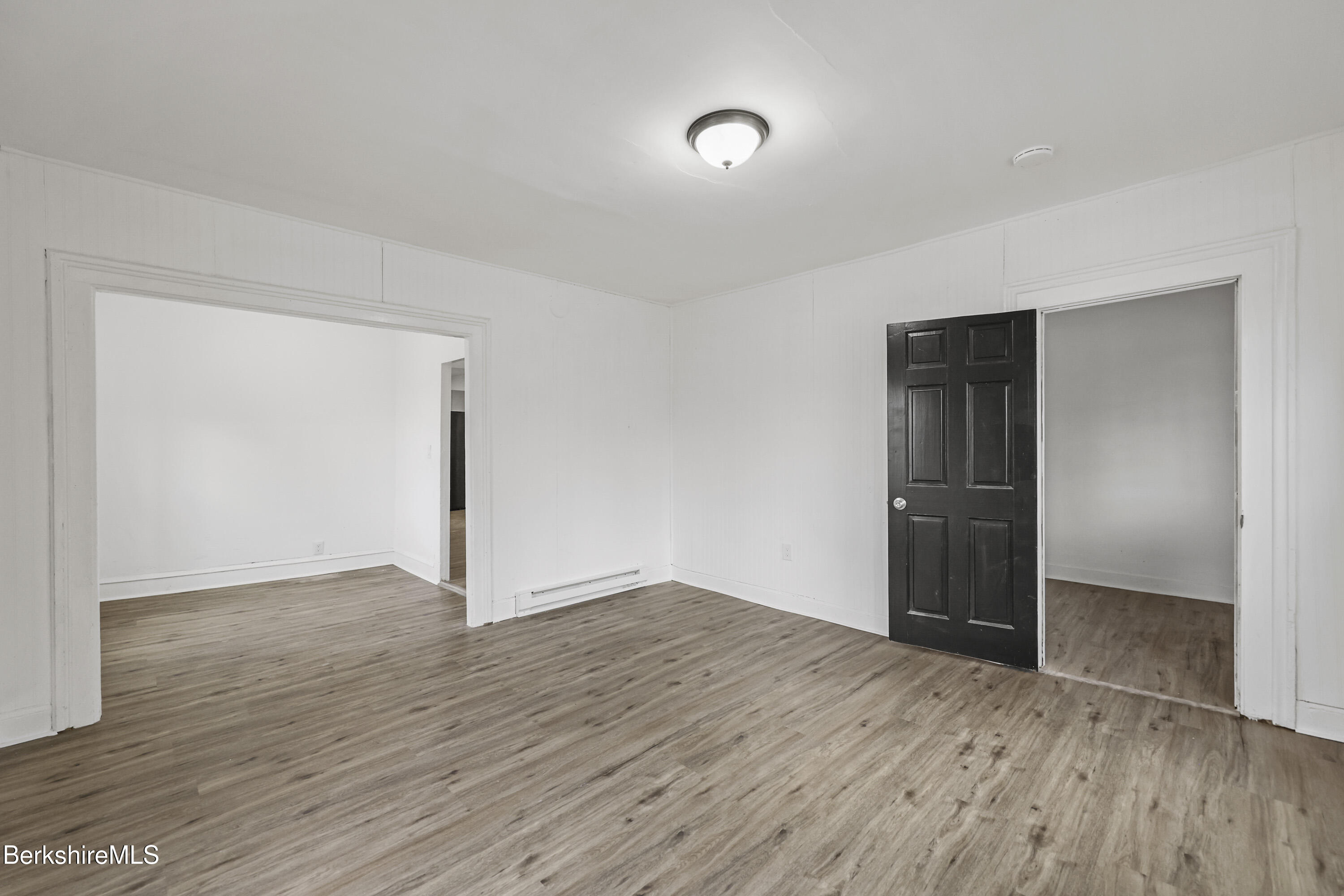 41 Prospect Street North Adams, MA 01247 - Photo 5 of 34 an empty room with wooden floor & closet and natural light