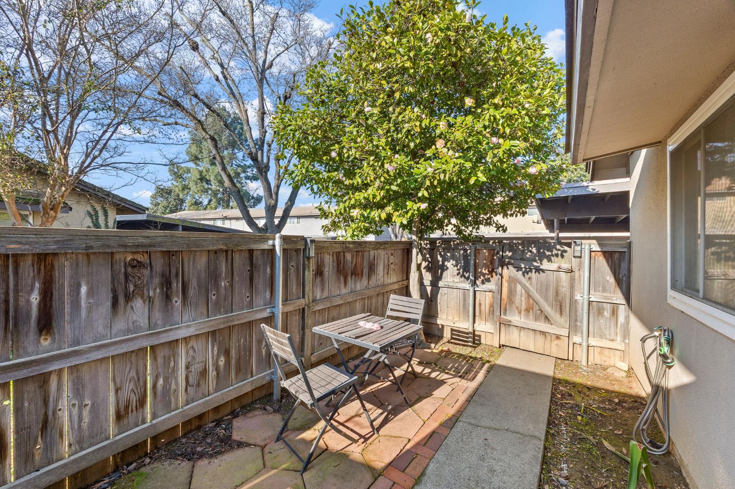8849 La Riviera Drive, Unit A Sacramento, CA 95826 - Photo 17 of 19 a view of balcony with wooden floor and outdoor seating