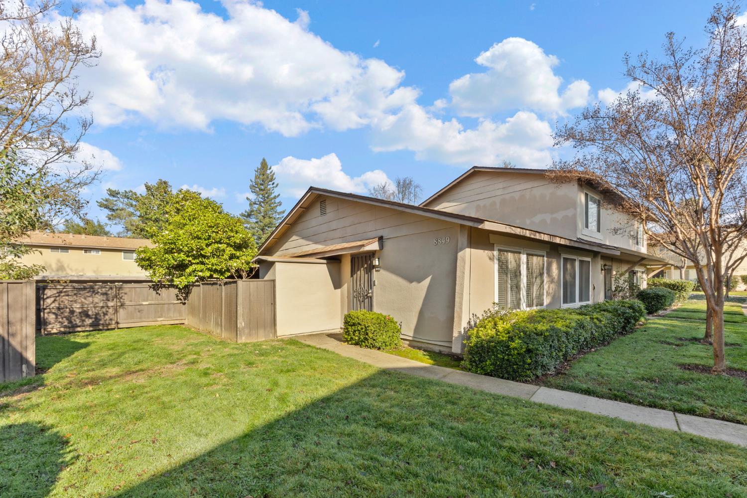 8849 La Riviera Drive, Unit A Sacramento, CA 95826 - Photo 2 of 19 a front view of a house with garden