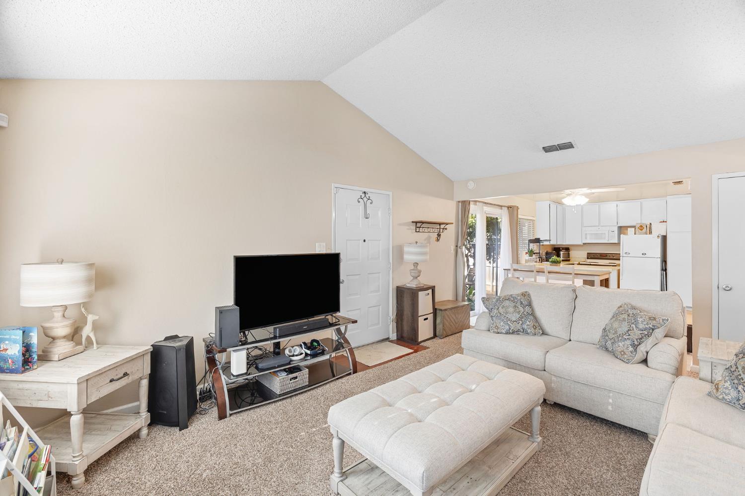 8849 La Riviera Drive, Unit A Sacramento, CA 95826 - Photo 5 of 19 a living room with furniture and a flat screen tv