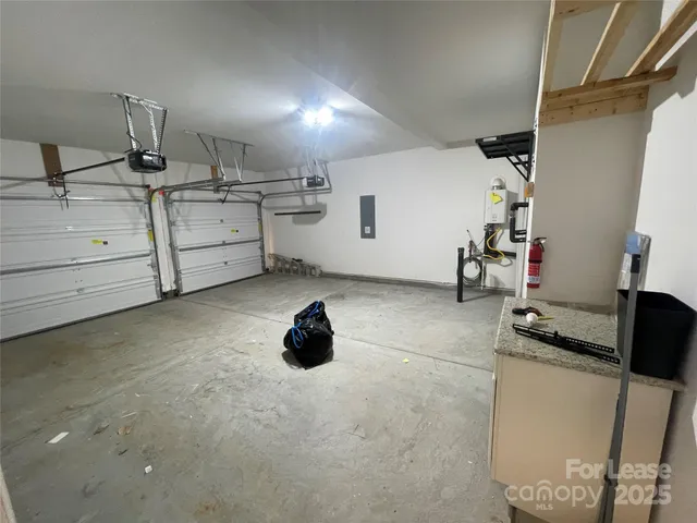 a view of a storage & utility room with two washing machine