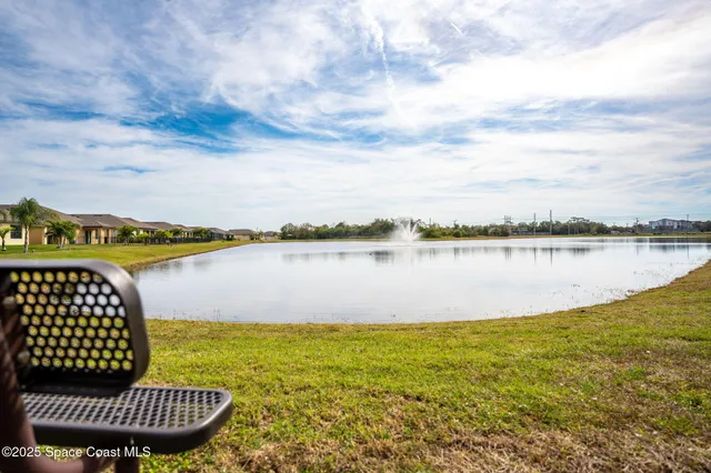 a view of a lake with houses in the back
