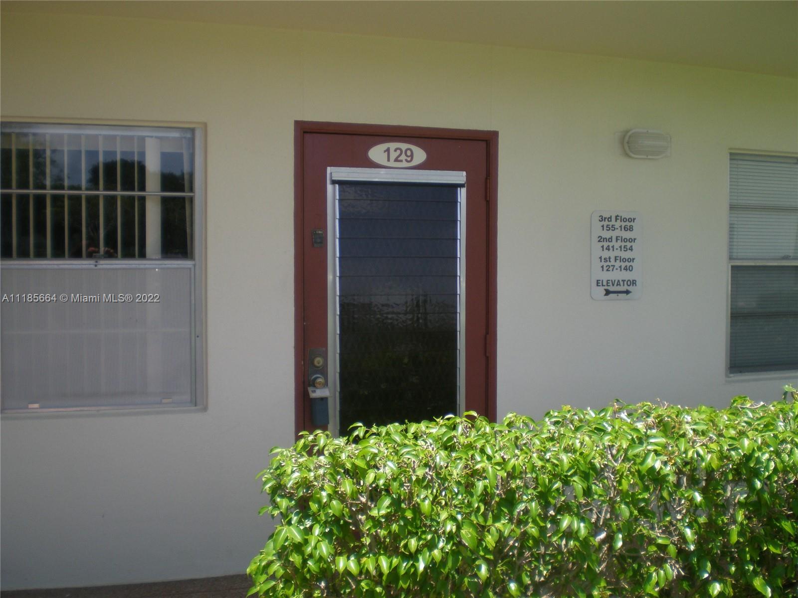 129 Brighton D, Unit 129 Boca Raton, FL 33434 - Photo 2 of 28 a view of a wooden door