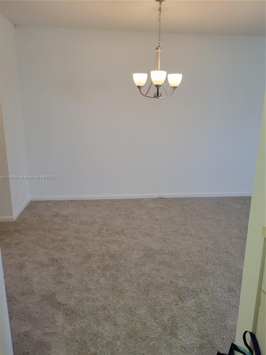 129 Brighton D, Unit 129 Boca Raton, FL 33434 - Photo 6 of 28 a view of a room with a sink and cabinets