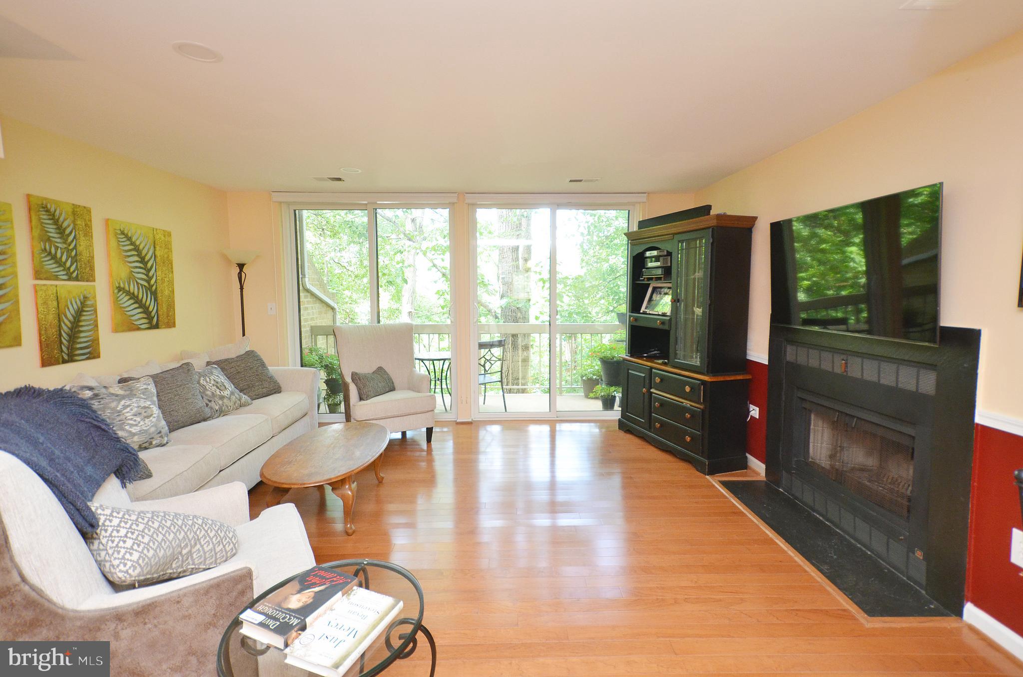 11214 Beaver Trail Court, Unit 12 Reston, VA 20191 - Photo 11 of 27 a living room with furniture and a flat screen tv