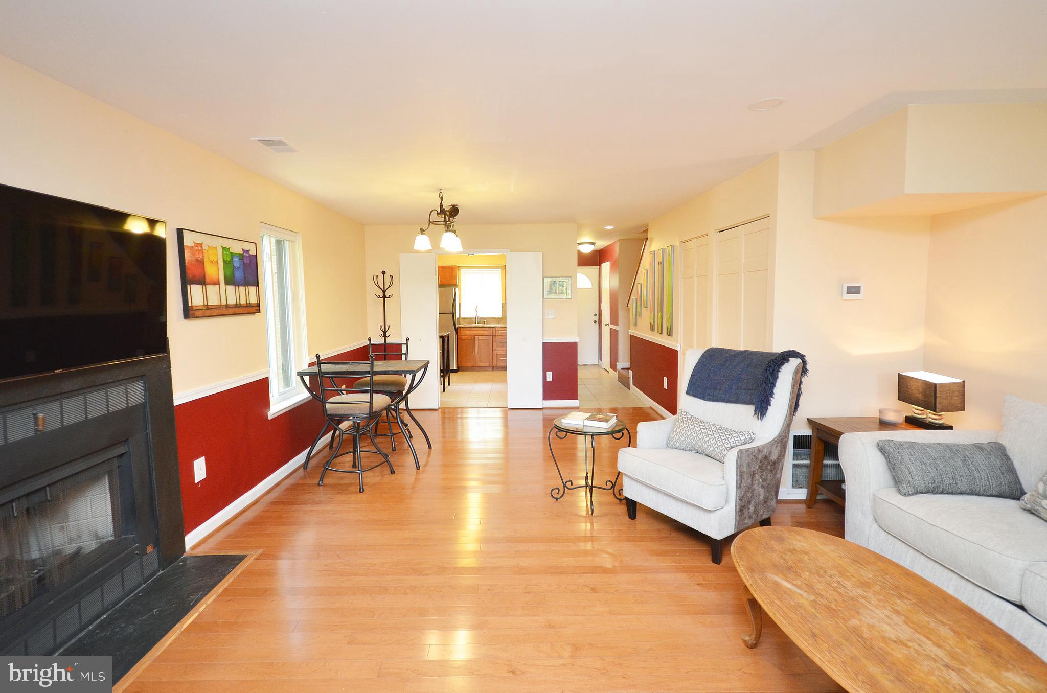 11214 Beaver Trail Court, Unit 12 Reston, VA 20191 - Photo 13 of 27 a living room with furniture and a flat screen tv
