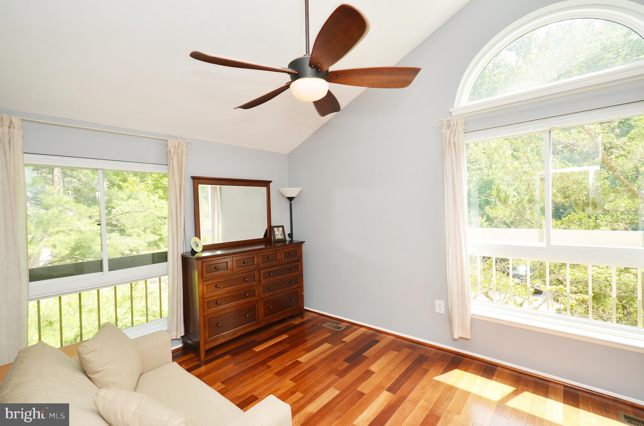 11214 Beaver Trail Court, Unit 12 Reston, VA 20191 - Photo 21 of 27 a living room with a bed furniture and a large window