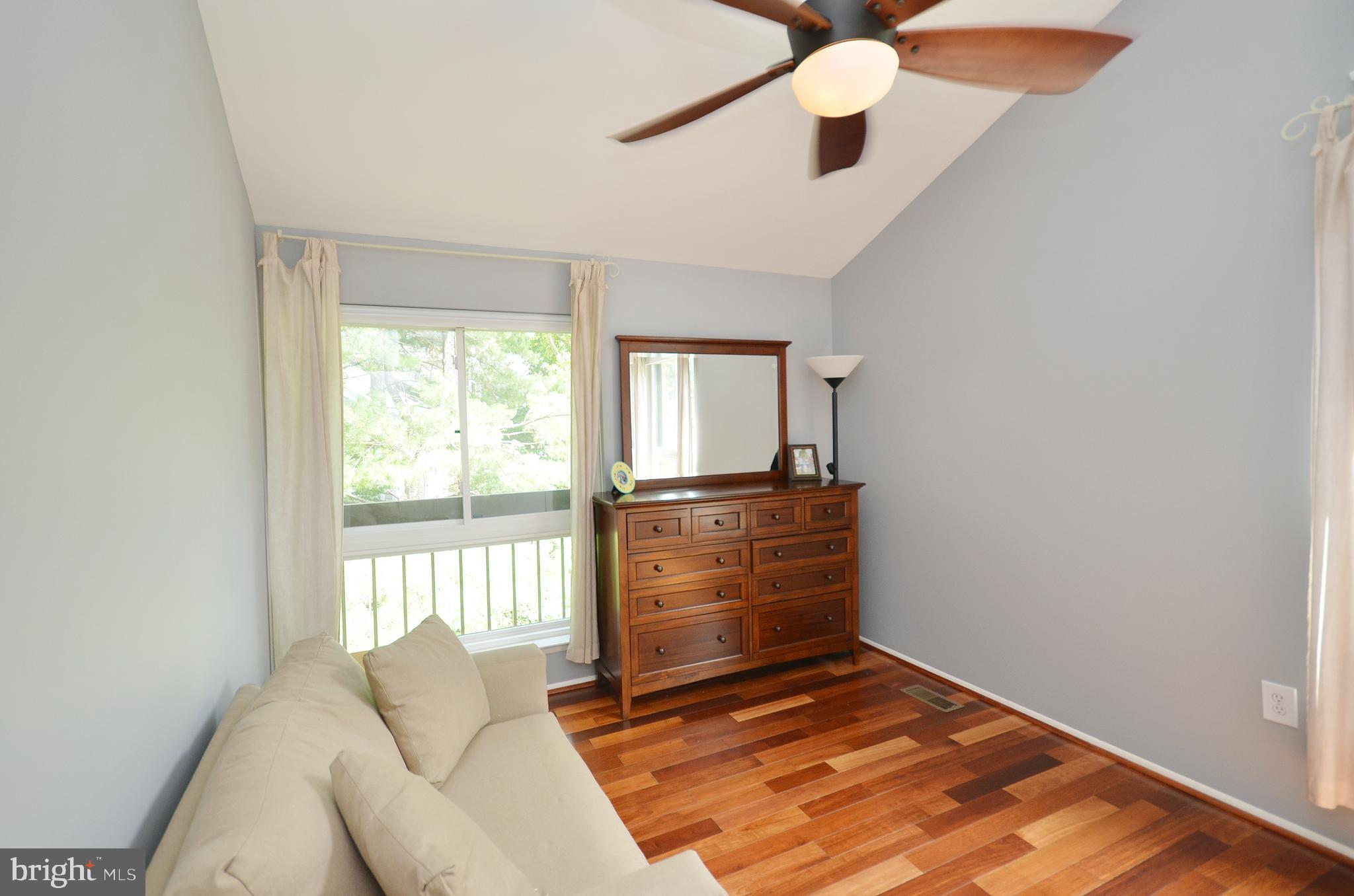 11214 Beaver Trail Court, Unit 12 Reston, VA 20191 - Photo 22 of 27 a room with a bed and a window