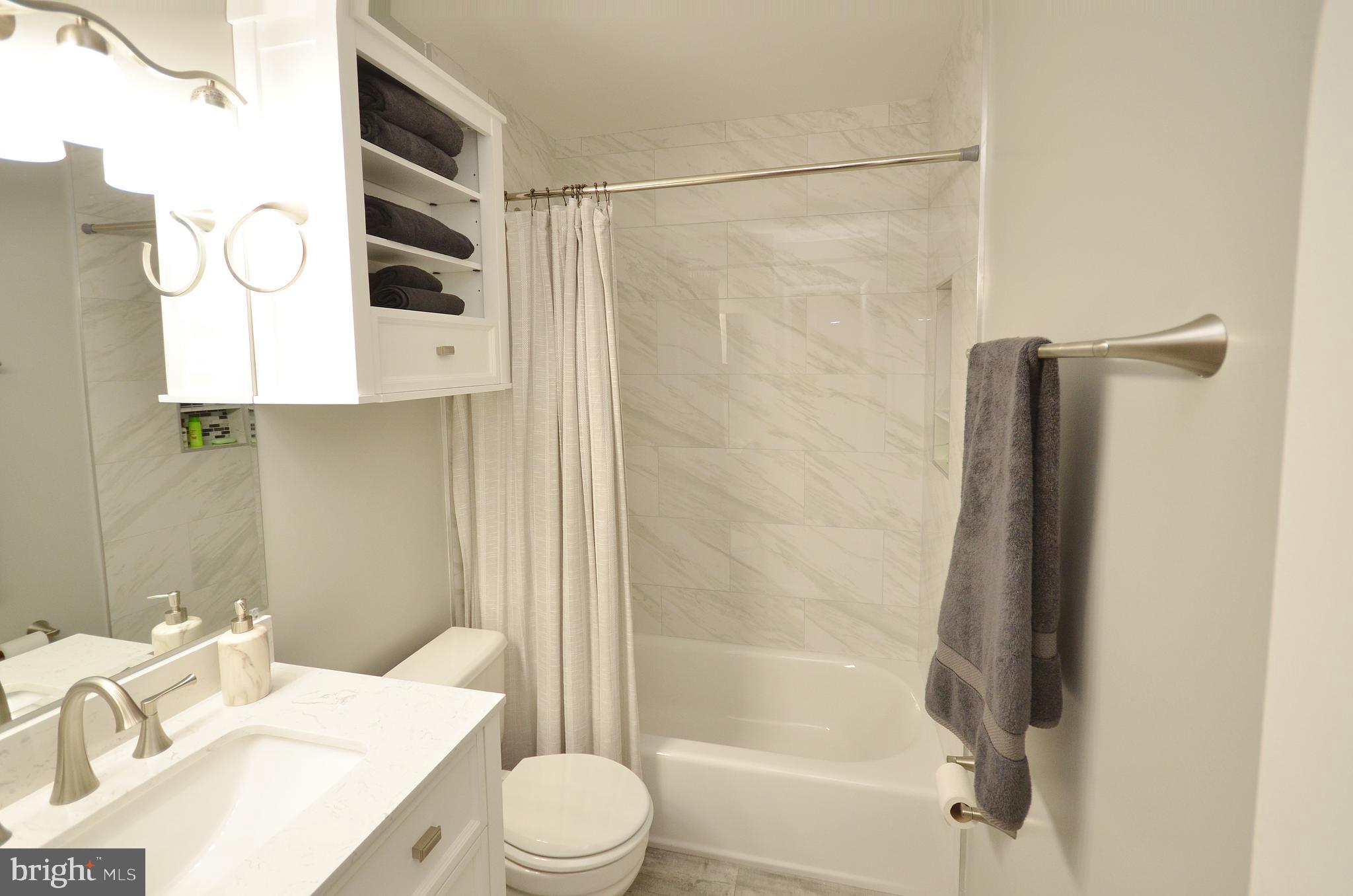 11214 Beaver Trail Court, Unit 12 Reston, VA 20191 - Photo 23 of 27 a bathroom with a sink toilet and shower