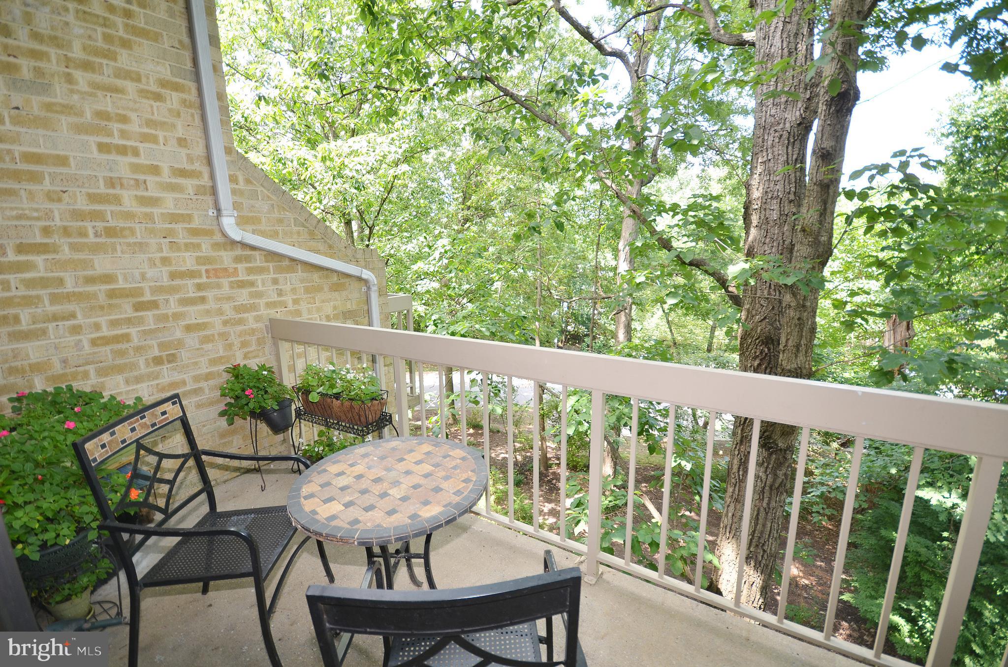 11214 Beaver Trail Court, Unit 12 Reston, VA 20191 - Photo 25 of 27 a view of a chair in wooden deck