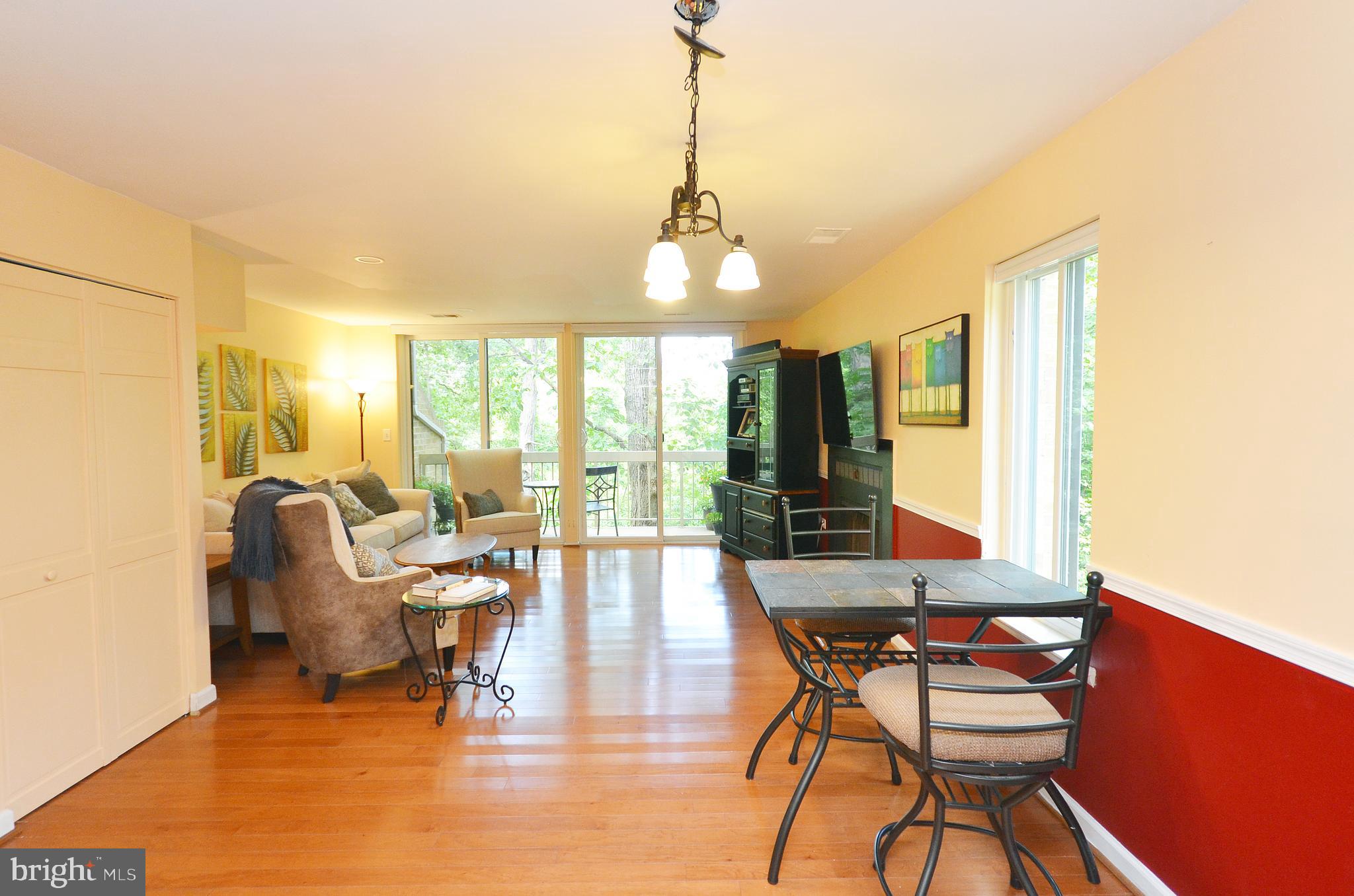 11214 Beaver Trail Court, Unit 12 Reston, VA 20191 - Photo 7 of 27 a dining room with furniture and wooden floor