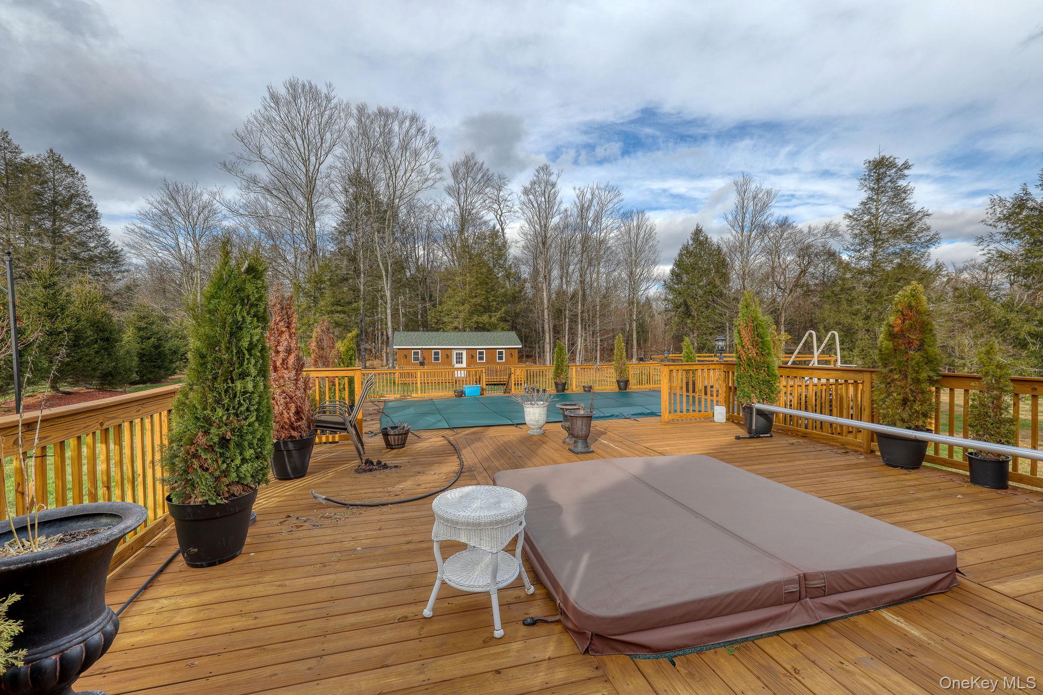 226 Big Woods Road Harris, NY 12742 - Photo 19 of 20 a backyard of a house with table and chairs