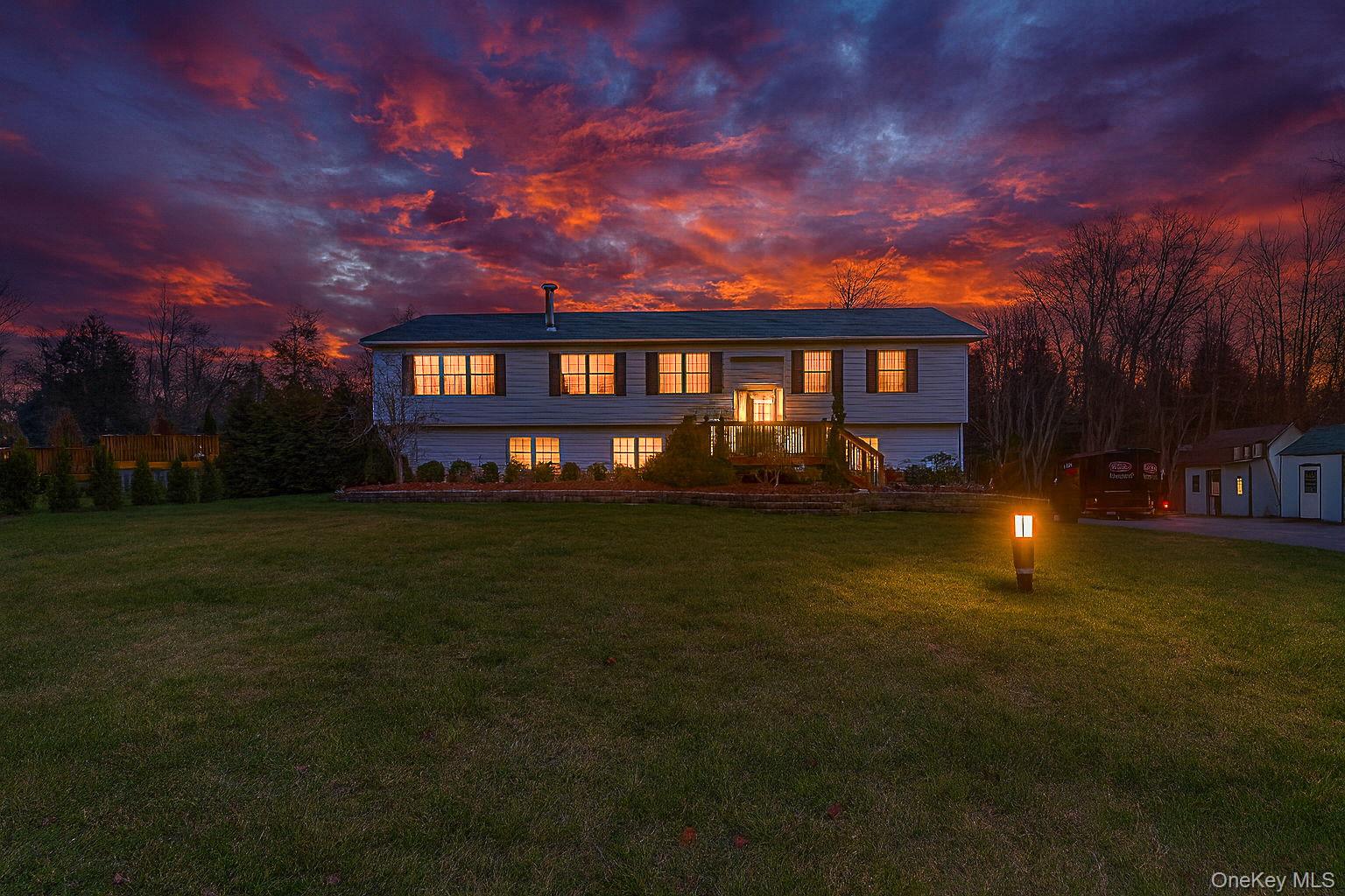226 Big Woods Road Harris, NY 12742 - Photo 2 of 20 a front view of a house with a garden