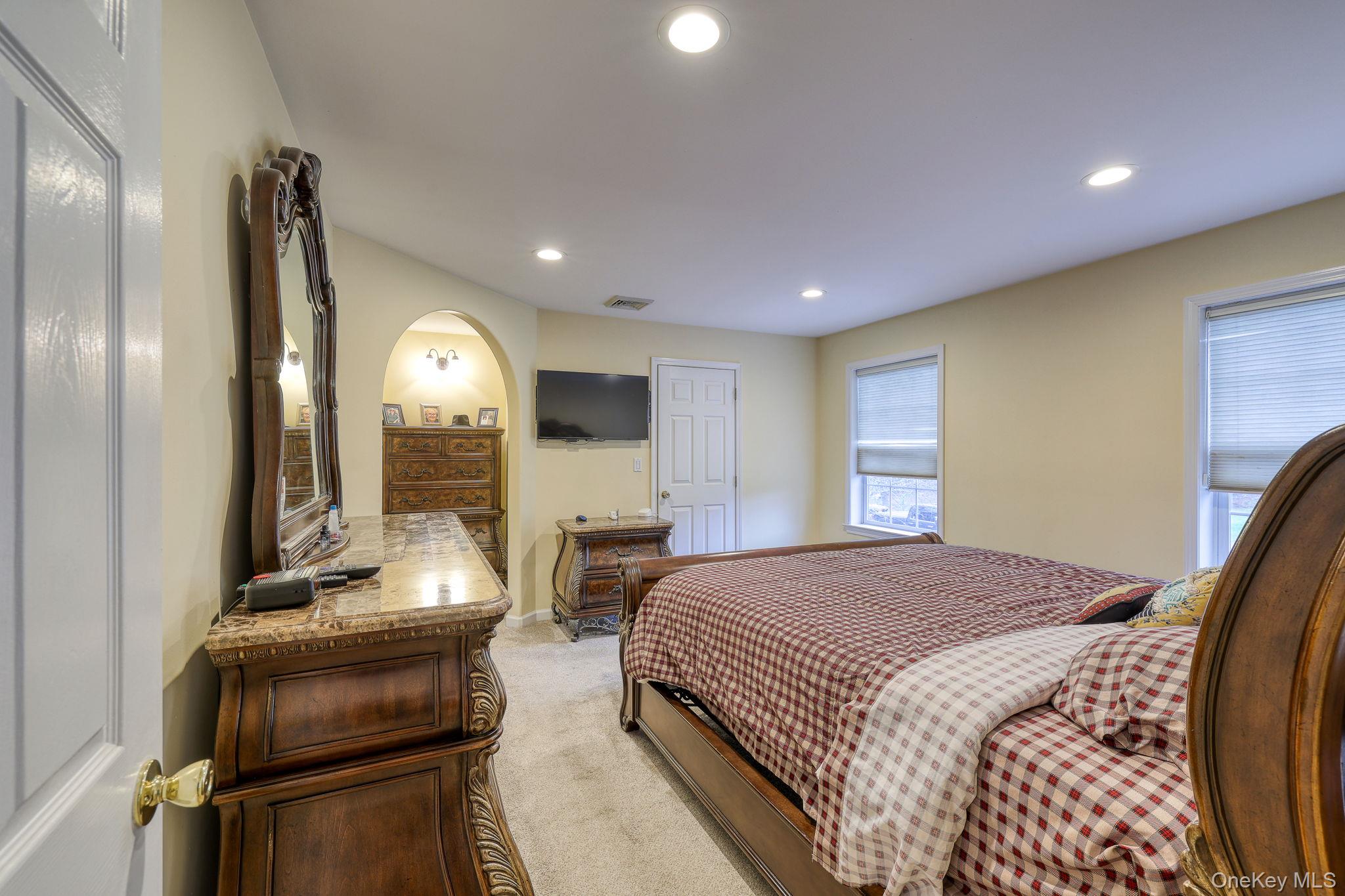 226 Big Woods Road Harris, NY 12742 - Photo 6 of 20 a bedroom with a bed and wooden floor