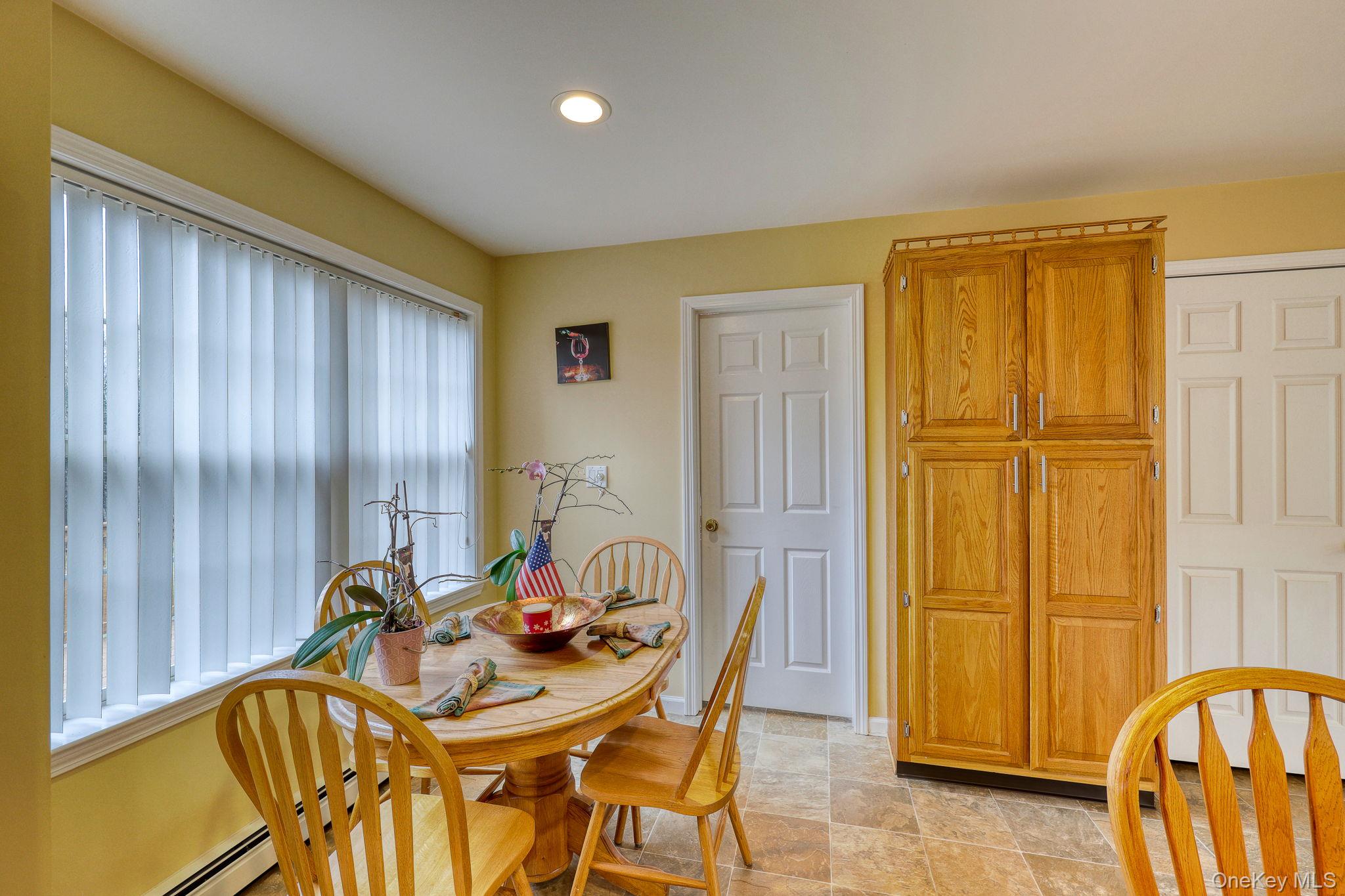 226 Big Woods Road Harris, NY 12742 - Photo 7 of 20 a view of a dining room with furniture and chandelier