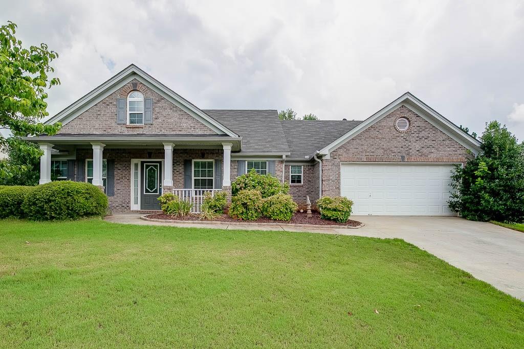 952 Jasmine Drive Jefferson, GA 30549 - Photo 1 of 1 a front view of a house with a yard and garage