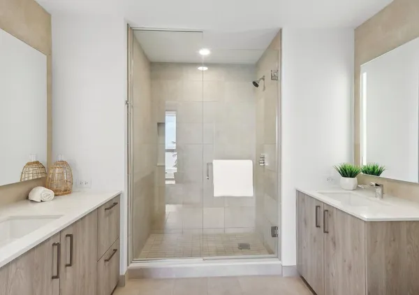 a bathroom with a double vanity sink mirror and double