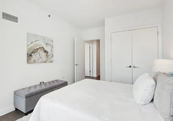 a living room with a table and chairs next to a window