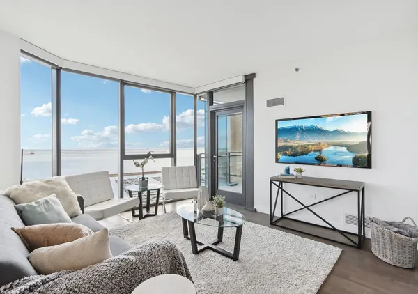 a dining room with furniture and wooden floor