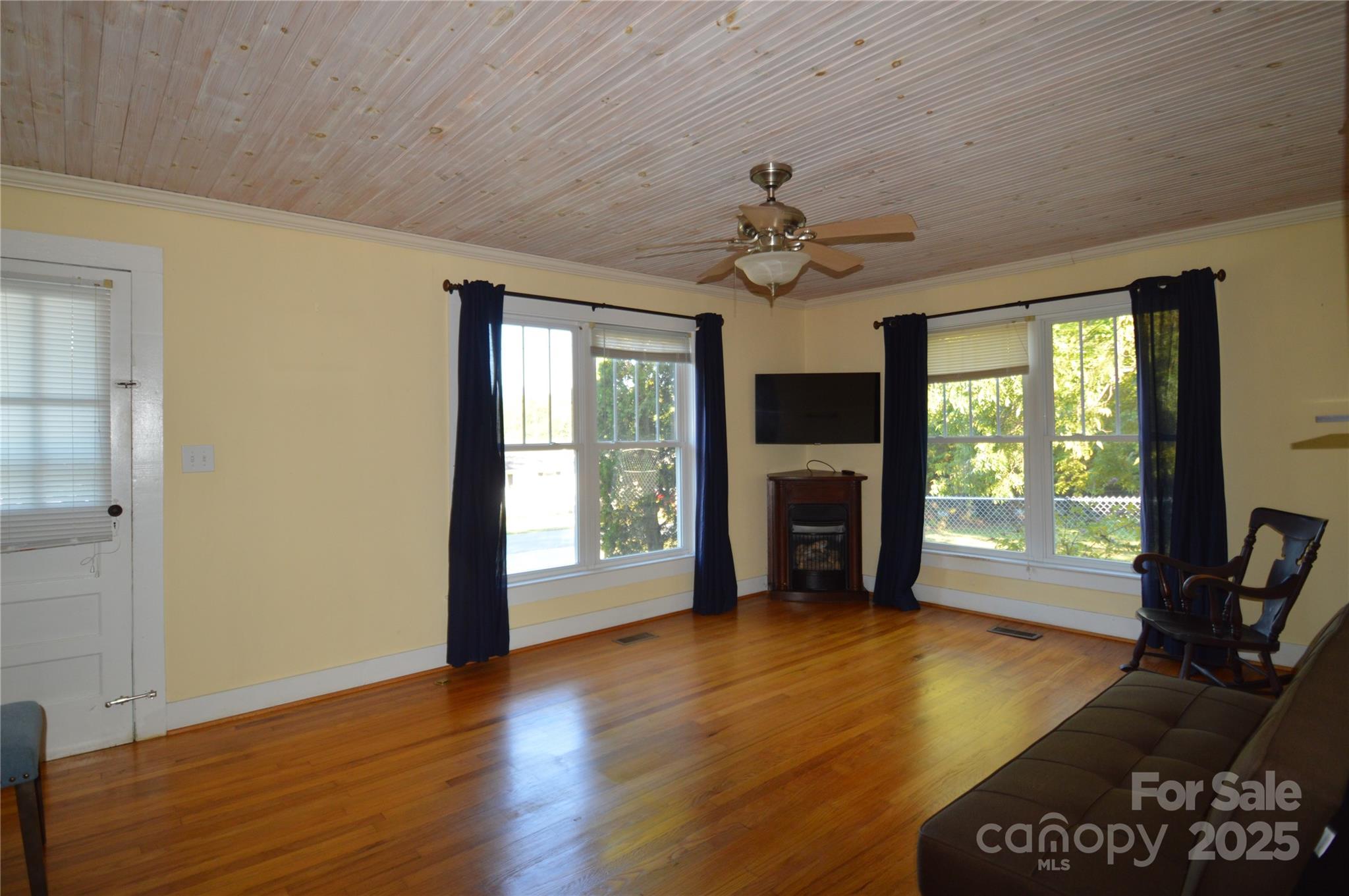 412 North Oak Avenue Landrum, SC 29356 - Photo 18 of 36 a view of an empty room with a window and wooden floor