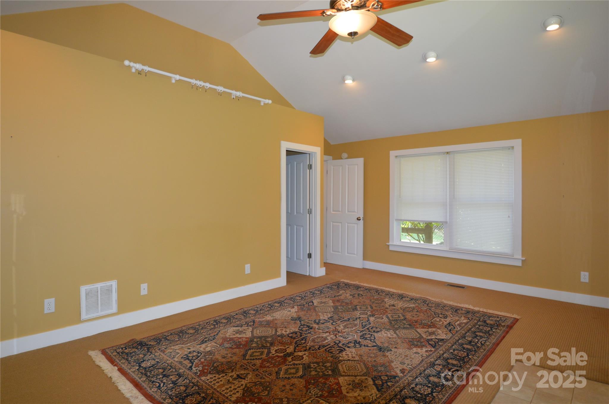 412 North Oak Avenue Landrum, SC 29356 - Photo 28 of 36 an empty room with a ceiling fan and a rug