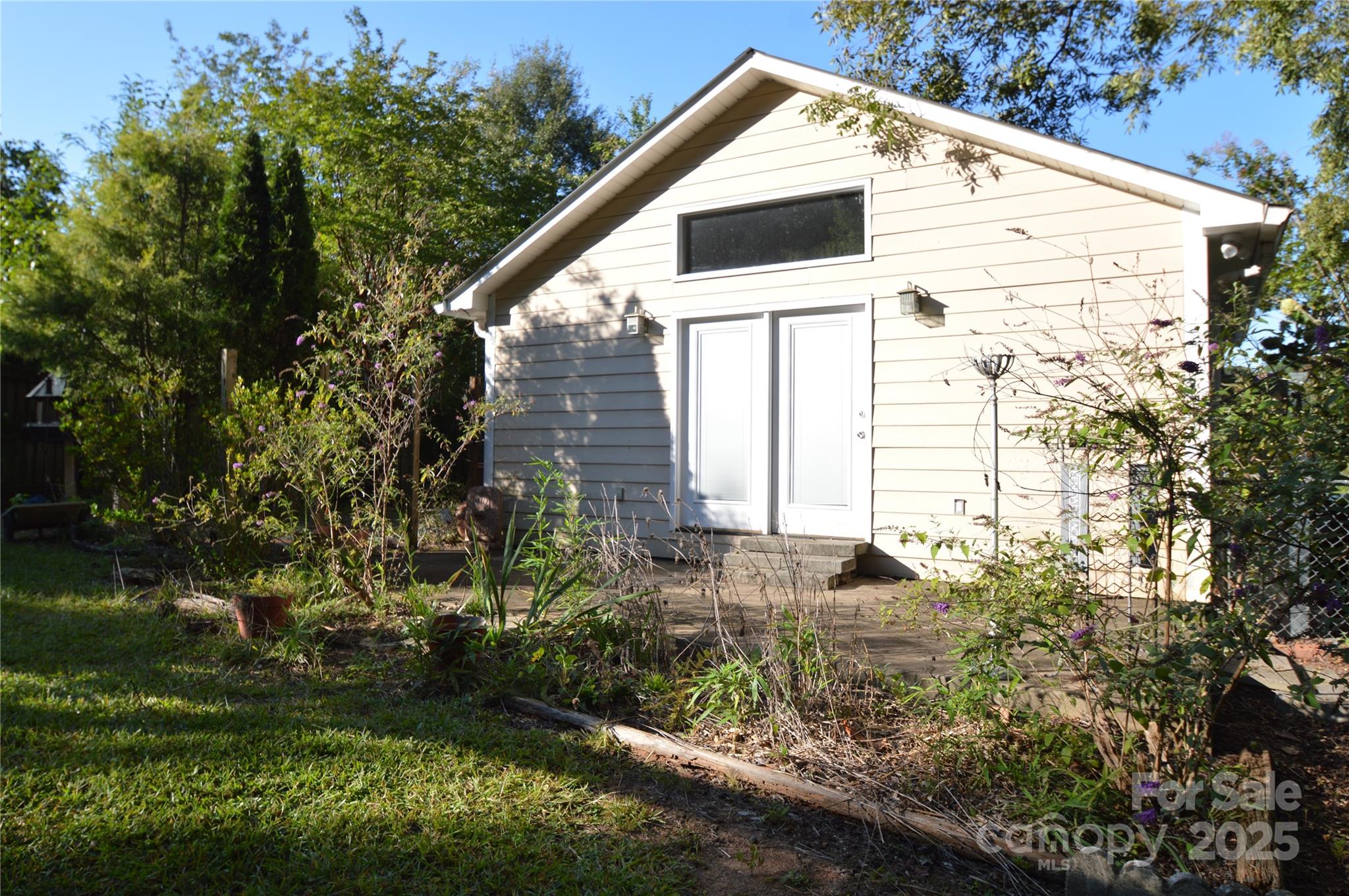 412 North Oak Avenue Landrum, SC 29356 - Photo 6 of 36 a view of a house with backyard
