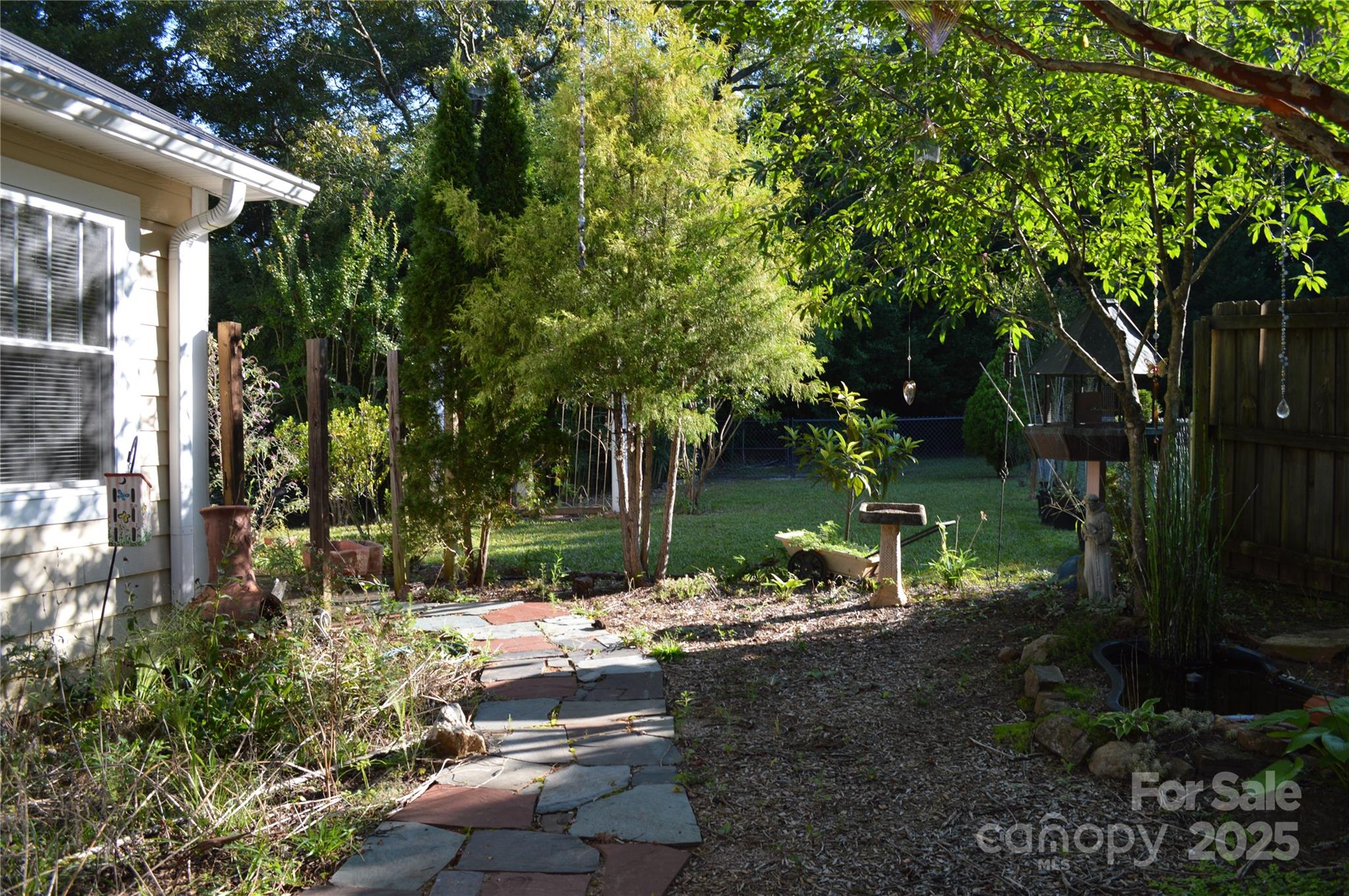 412 North Oak Avenue Landrum, SC 29356 - Photo 10 of 36 a view of backyard with outdoor seating and green space