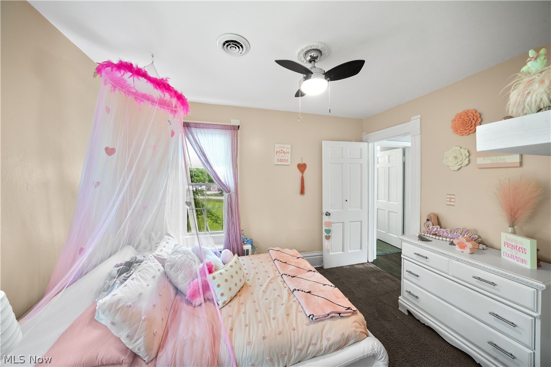 2069 State Road Northwest Warren, OH 44481 - Photo 21 of 45 Carpeted bedroom with ceiling fan