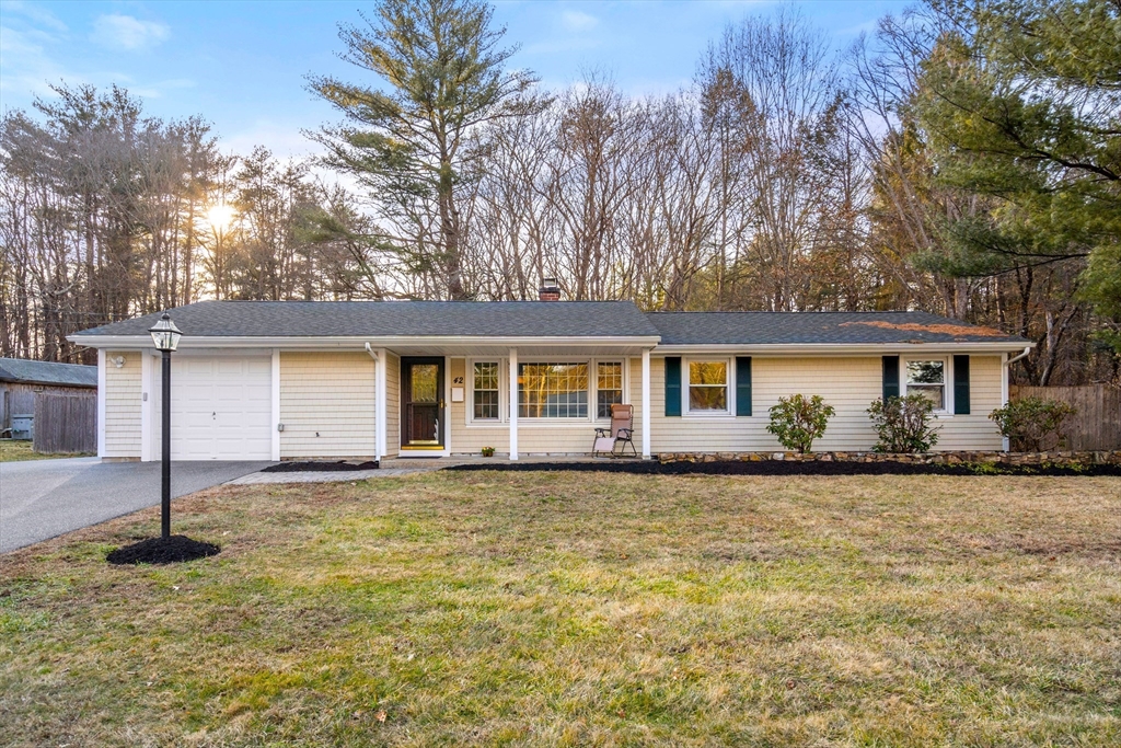 42 Gregory Road Framingham, MA 01701 - Photo 1 of 23 a front view of a house with a garden