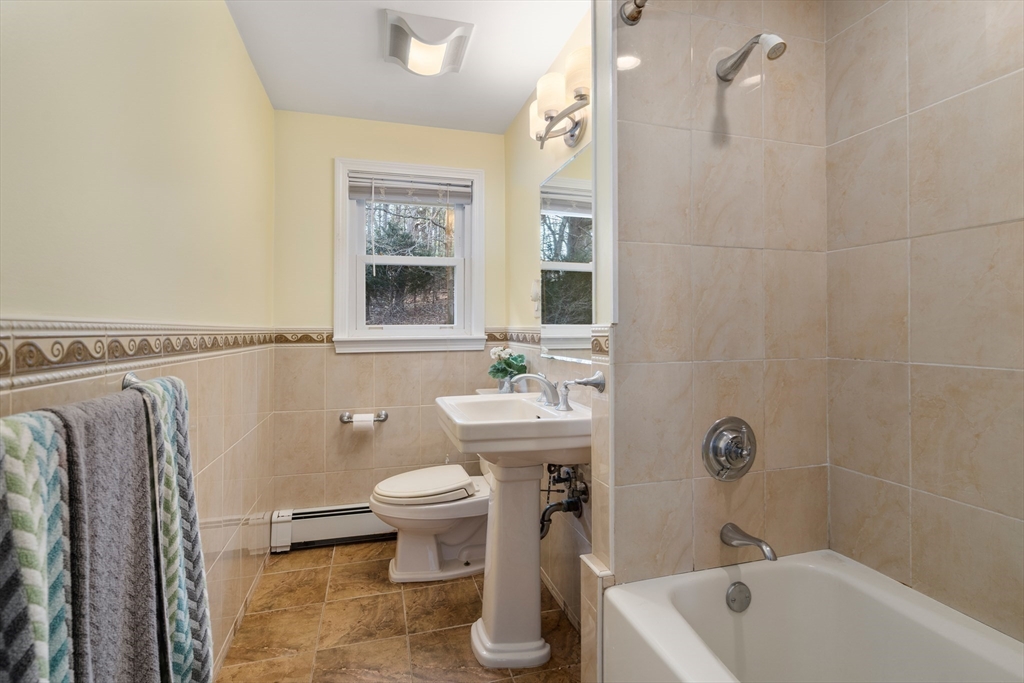 42 Gregory Road Framingham, MA 01701 - Photo 12 of 23 a bathroom with a sink a toilet and shower