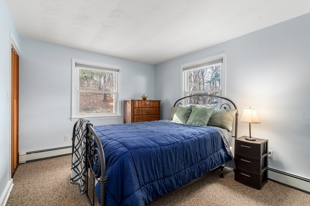 42 Gregory Road Framingham, MA 01701 - Photo 13 of 23 a bedroom with a bed and a cabinets