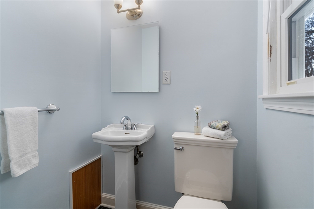 42 Gregory Road Framingham, MA 01701 - Photo 15 of 23 a bathroom with a sink mirror and toilet