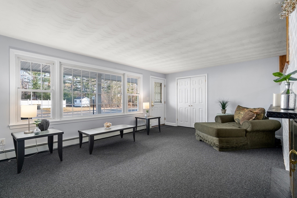 42 Gregory Road Framingham, MA 01701 - Photo 4 of 23 a living room with furniture and windows