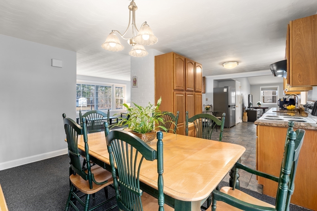 42 Gregory Road Framingham, MA 01701 - Photo 6 of 23 a view of a dining room with furniture and wooden floor