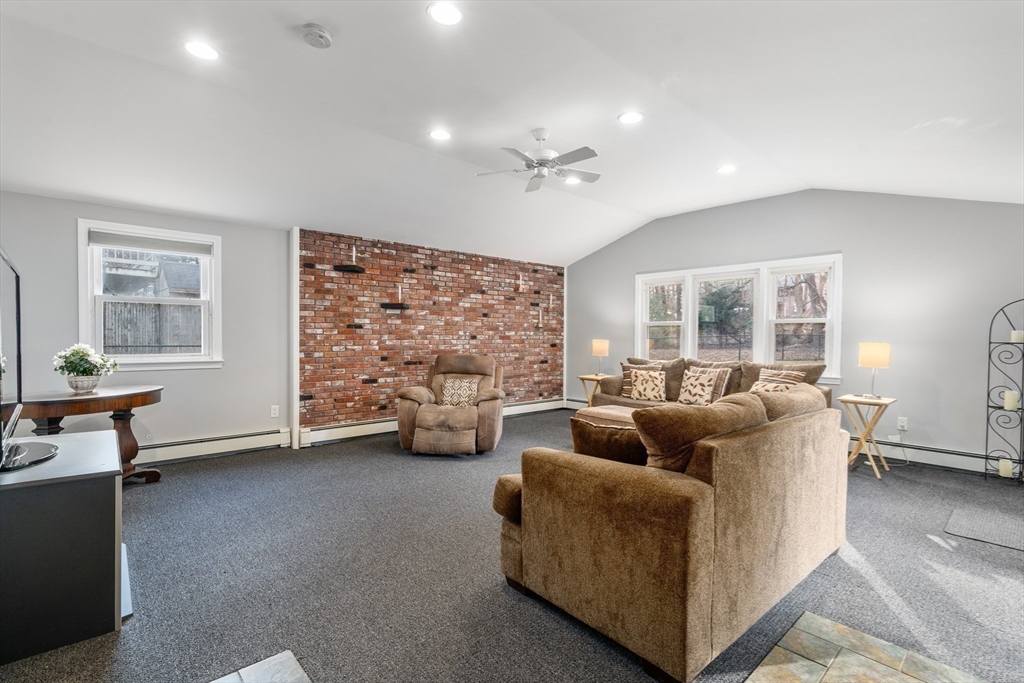 42 Gregory Road Framingham, MA 01701 - Photo 9 of 23 a living room with furniture and a flat screen tv