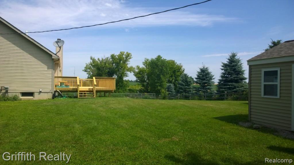 736 Fowlerville Road Fowlerville, MI 48836 - Photo 63 of 84 Large Garden Shed in forefront. New Deck. Fenced Yard.