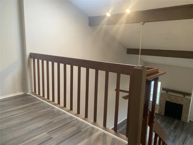a bathroom with a sink shower and a mirror