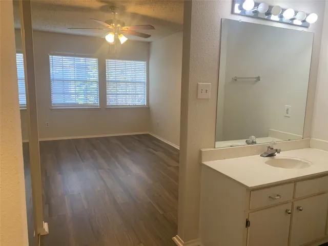 a view of hallway with wooden floor