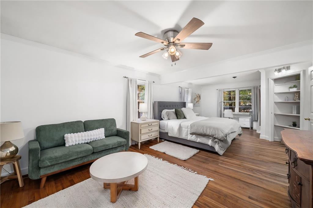 866 Buckner Road Mableton, GA 30126 - Photo 17 of 57 a spacious bedroom with a bed a couch and a bookshelf