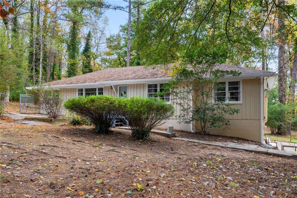 866 Buckner Road Mableton, GA 30126 - Photo 2 of 57 a view of a house with backyard and sitting area
