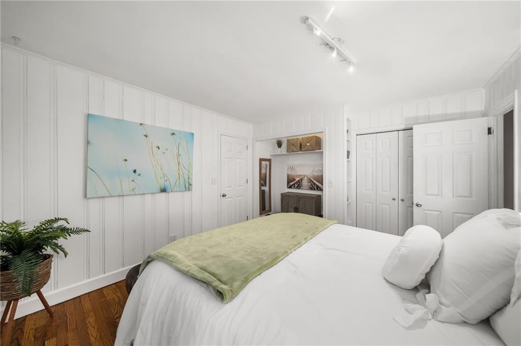 866 Buckner Road Mableton, GA 30126 - Photo 24 of 57 a bedroom with a bed and a potted plant