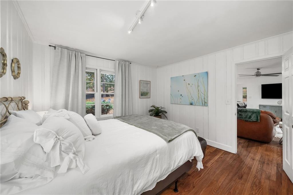 866 Buckner Road Mableton, GA 30126 - Photo 25 of 57 a bedroom with a bed and wooden floor