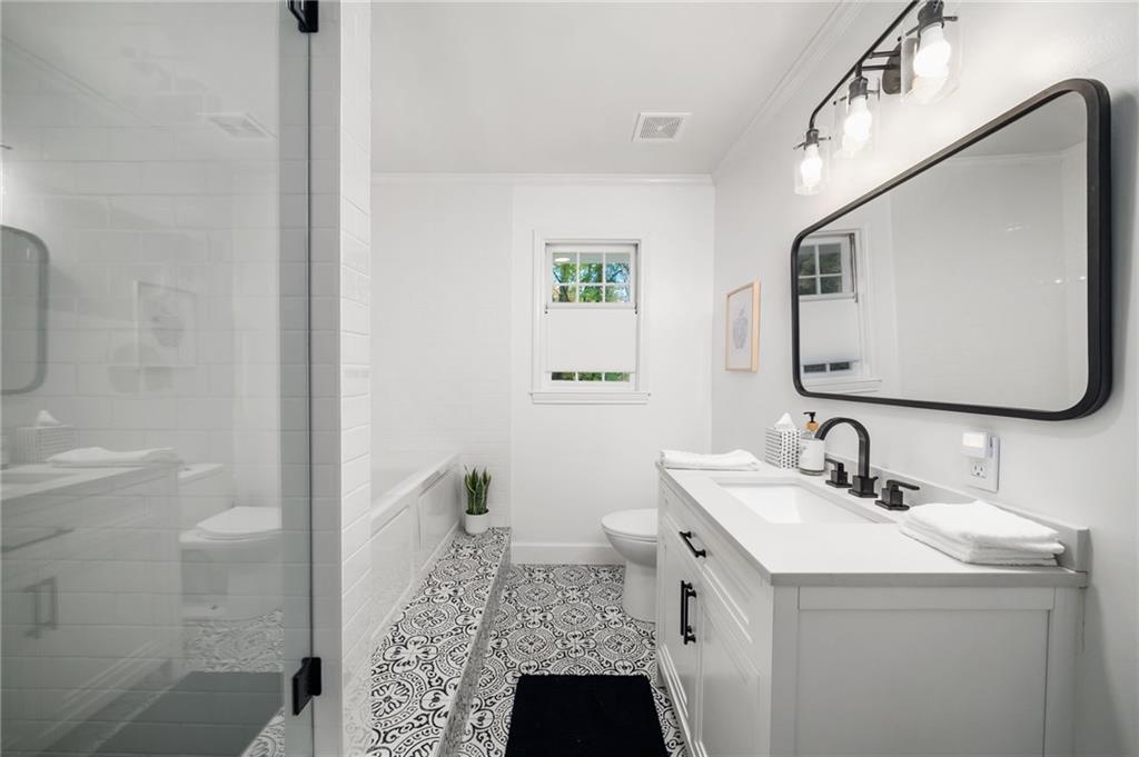 866 Buckner Road Mableton, GA 30126 - Photo 26 of 57 a bathroom with a sink and a mirror