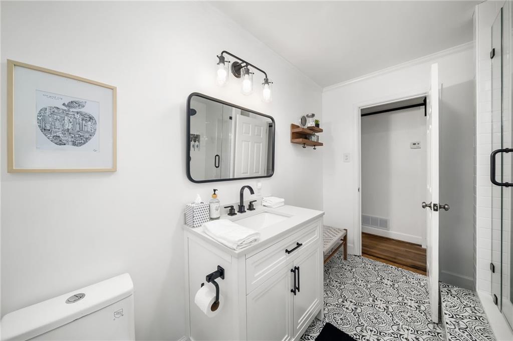 866 Buckner Road Mableton, GA 30126 - Photo 27 of 57 a bathroom with a sink and a mirror