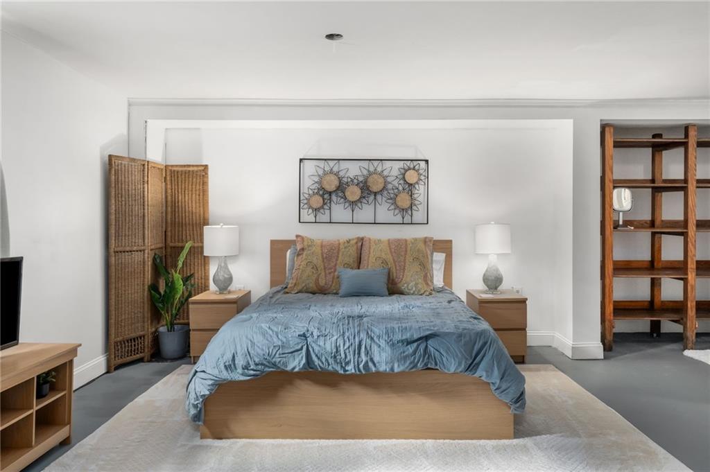 866 Buckner Road Mableton, GA 30126 - Photo 30 of 57 a bedroom with a large bed and a couch